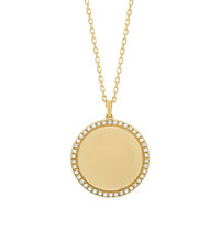 14K gold diamond disc pendant on white background – elegant fine jewelry featuring a round gold disc adorned with sparkling diamonds, hanging from a delicate gold chain.