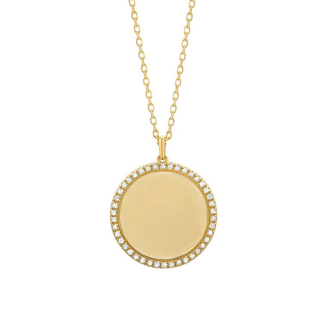 14K gold diamond disc pendant on white background – elegant fine jewelry featuring a round gold disc adorned with sparkling diamonds, hanging from a delicate gold chain.