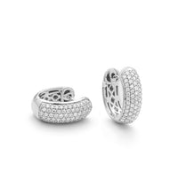 14K white gold diamond huggie earrings on white background – elegant fine jewelry featuring small hoops adorned with sparkling diamonds.