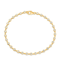 Diamond bezel bracelet in 14K yellow gold on white background – elegant fine jewelry featuring diamonds set in bezel settings along a yellow gold chain.