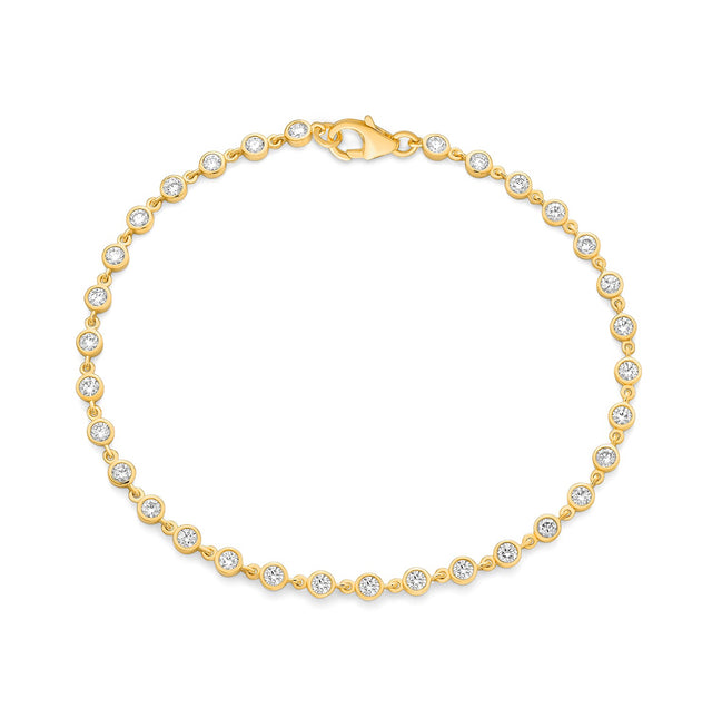 Diamond bezel bracelet in 14K yellow gold on white background – elegant fine jewelry featuring diamonds set in bezel settings along a yellow gold chain.