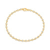 Diamond bezel bracelet in 14K yellow gold on white background – elegant fine jewelry featuring diamonds set in bezel settings along a yellow gold chain.