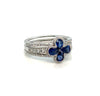 Diamond and sapphire 14K gold floral ring on white background – elegant fine jewelry featuring blue sapphires and sparkling diamonds arranged in a flower-inspired design.