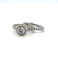 Platinum diamond halo wedding set on white background – elegant bridal jewelry featuring a halo-style engagement ring and a matching diamond wedding band crafted in polished platinum.
