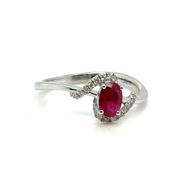 Ruby and diamond 14K white gold ring on white background – elegant fine jewelry featuring a vivid red ruby center stone accented with sparkling diamonds in a white gold setting.