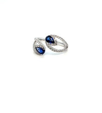 Sapphire and diamond open ring on white background – modern 14K gold ring featuring blue sapphire and brilliant diamond accents in an open band design.