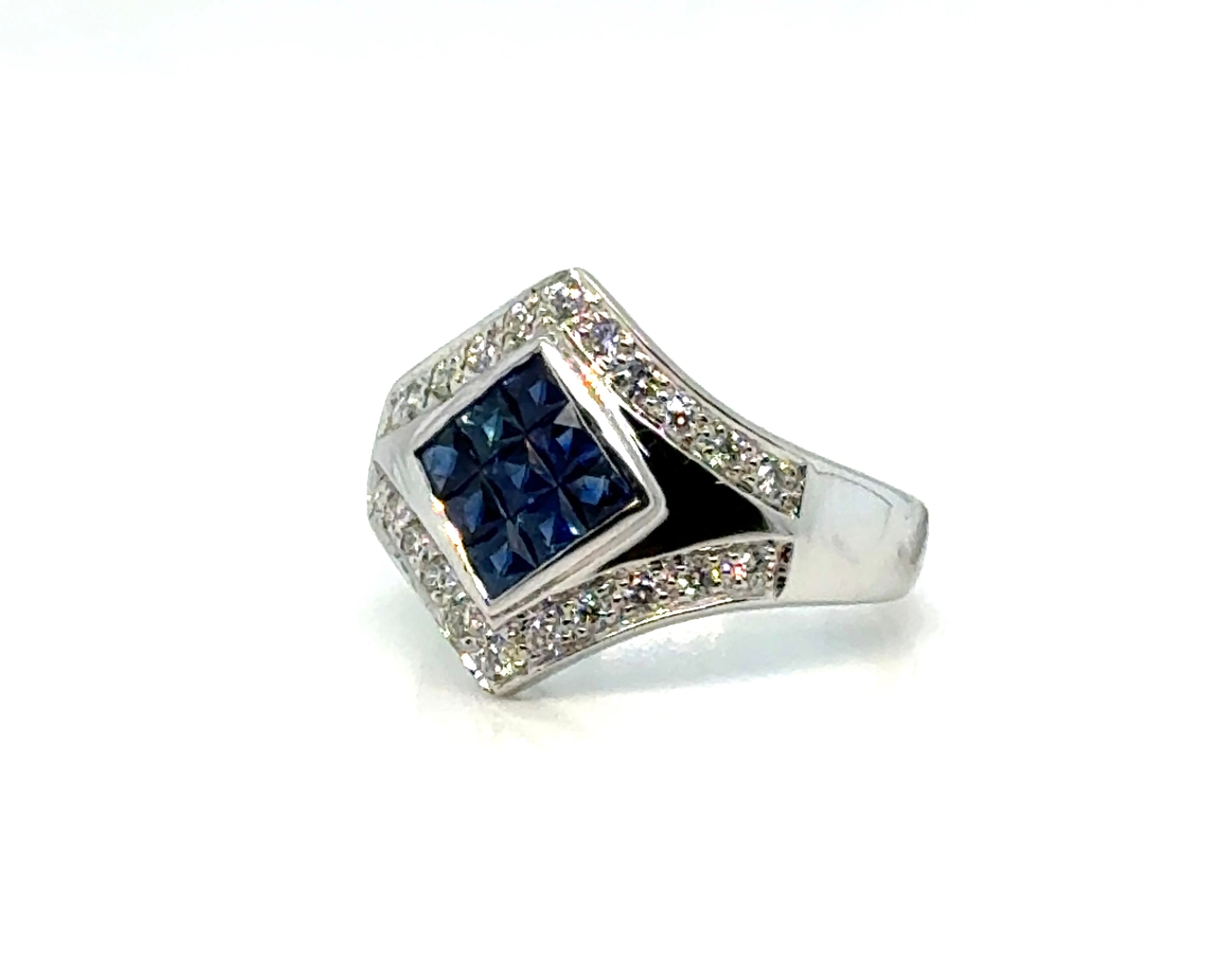 Sapphire mosaic diamond ring in 18K gold on white background – luxurious fine jewelry featuring a mosaic pattern of blue sapphires and sparkling diamonds set in 18-karat yellow gold.
