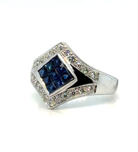Sapphire mosaic diamond ring in 18K gold on white background – luxurious fine jewelry featuring a mosaic pattern of blue sapphires and sparkling diamonds set in 18-karat yellow gold.